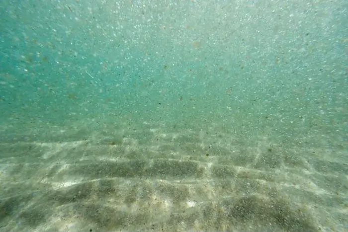 Framed Print : Underwater floating particles of sand. High quality photo Framed Print : Underwater floating particles of sand. High quality photo