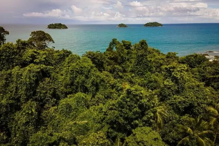 Framed Print : Uninhabited Tropical Island with ocean and more islands in distance Framed Print : Uninhabited Tropical Island with ocean and more islands in distance