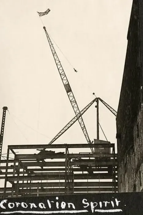 Framed Print : A Union Jack flies from the top of a crane on a construction site to celebrate the Coronation of the British monarch Framed Print : A Union Jack flies from the top of a crane on a construction site to celebrate the Coronation of the British monarch