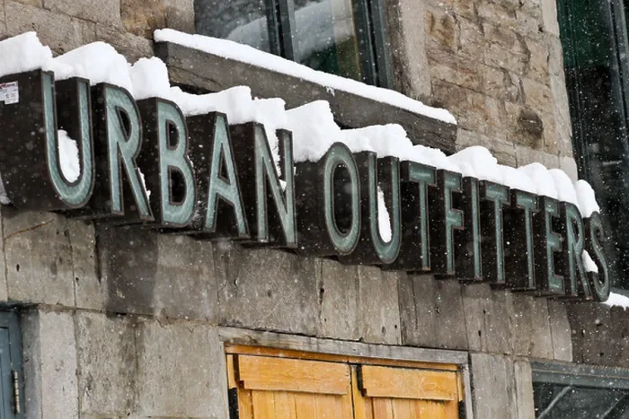 Framed Print : The Urban Outfitters sign covered in snow on St. Denis in Montreal, Quebec Framed Print : The Urban Outfitters sign covered in snow on St. Denis in Montreal, Quebec