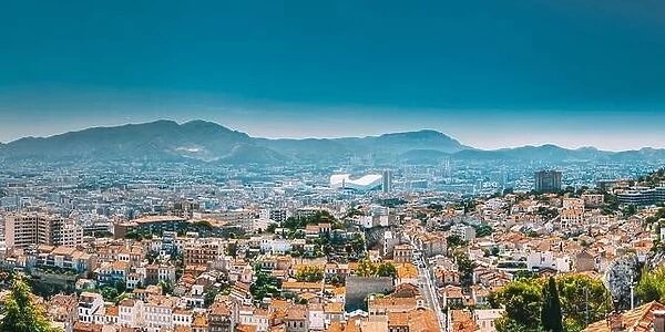 Urban panorama, aerial view, cityscape of Marseille, France. Sunny summer day with bright blue sky. Cityscape of Marseille, France. Urban background