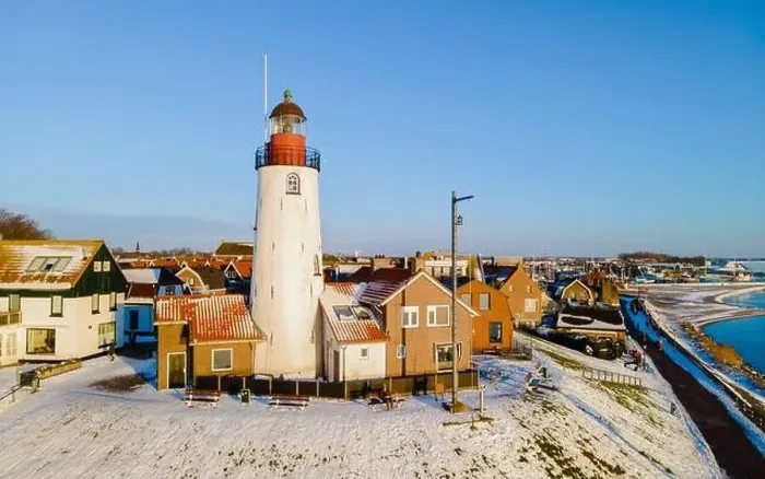Framed Print : Urk lighthouse during winter with snow landscape in the Netherlands Framed Print : Urk lighthouse during winter with snow landscape in the Netherlands