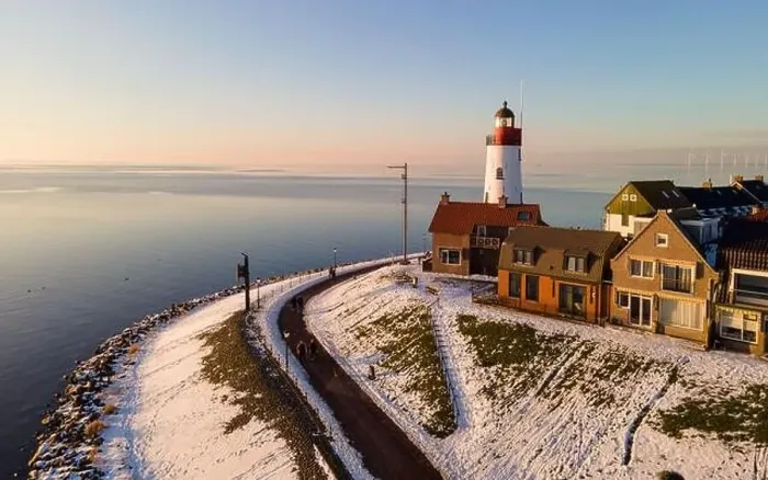Framed Print : Urk lighthouse during winter with snow landscape in the Netherlands Framed Print : Urk lighthouse during winter with snow landscape in the Netherlands