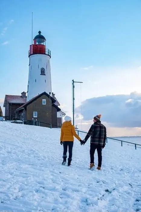 Framed Print : Urk Netherlands lighthouse during winter with snow covered coastline Framed Print : Urk Netherlands lighthouse during winter with snow covered coastline