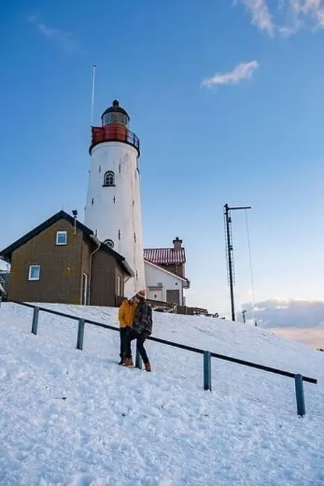 Framed Print : Urk Netherlands lighthouse during winter with snow covered coastline Framed Print : Urk Netherlands lighthouse during winter with snow covered coastline
