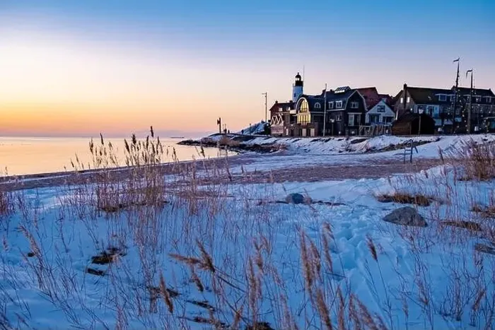 Framed Print : Urk Netherlands lighthouse during winter with snow covered coastline Framed Print : Urk Netherlands lighthouse during winter with snow covered coastline