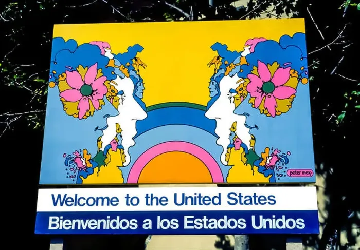 Framed Print : A U.S. government sign illustrated by American artist Peter Max welcomes visitors Framed Print : A U.S. government sign illustrated by American artist Peter Max welcomes visitors