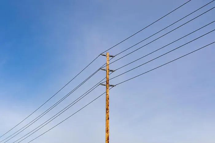 Framed Print : Utility pole and wires against sky Framed Print : Utility pole and wires against sky