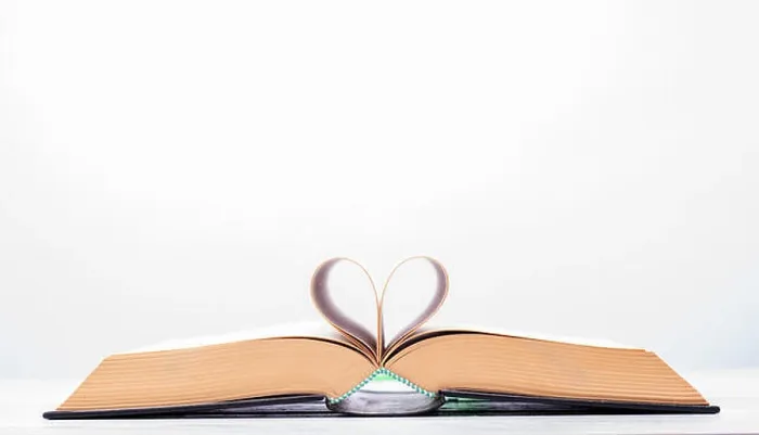 Framed Print : Valentine's day or reading concept with heart shaped book on white background Framed Print : Valentine's day or reading concept with heart shaped book on white background