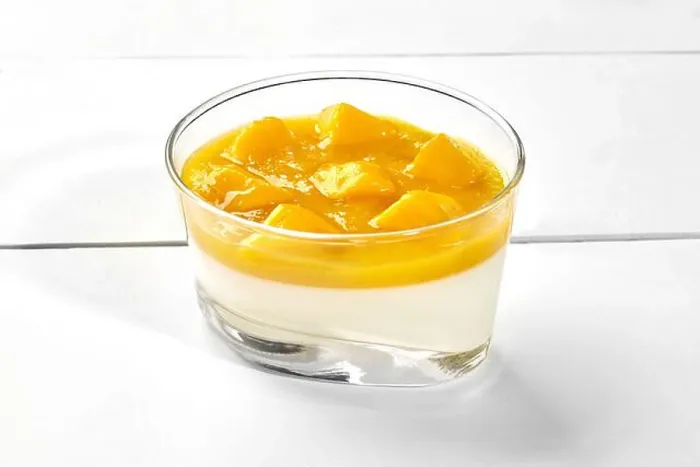 Framed Print : Vanilla panna cotta with mango puree and fresh fruits in glass