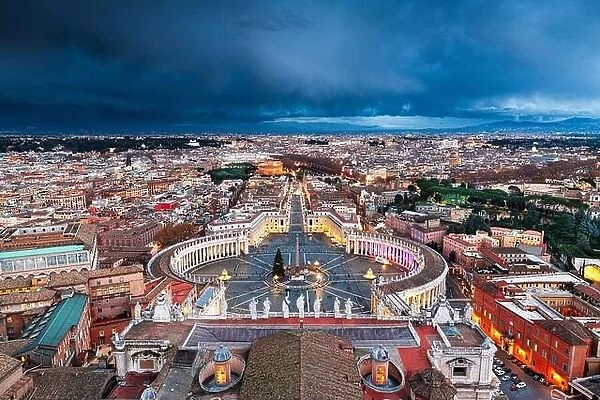 Vatican City State surrounded by Rome, Italy from above at night