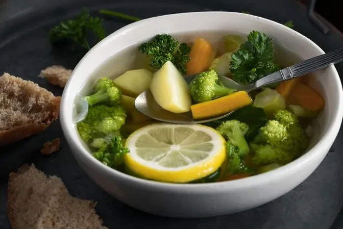 Framed Print : Vegetarian vegetable soup with carrots, broccoli and parsley in a light bowl on a metal tray on a wooden table Framed Print : Vegetarian vegetable soup with carrots, broccoli and parsley in a light bowl on a metal tray on a wooden table