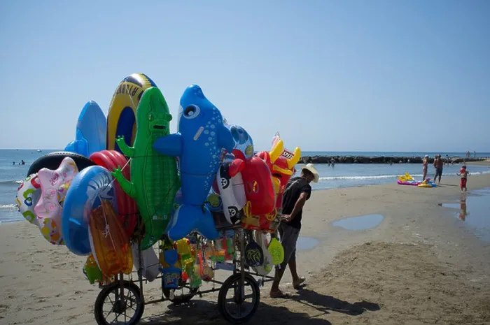 Framed Print : A vendor selling inflatable beach toys at outside Rome, Italy Framed Print : A vendor selling inflatable beach toys at outside Rome, Italy