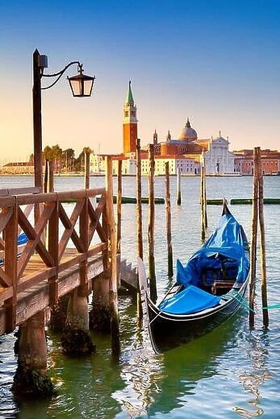 Venice Grand Canal - venetian gondola moored to molo San Marco, Venice, Italy