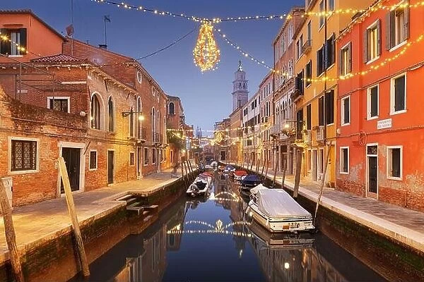 Venice, Italy cityscape over canals at twilight with Christmas lights