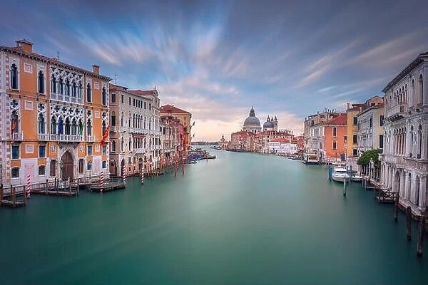 Venice, Italy. Cityscape image of Grand Canal in Venice, with Santa Maria della Salute Basilica in the background, during sunset