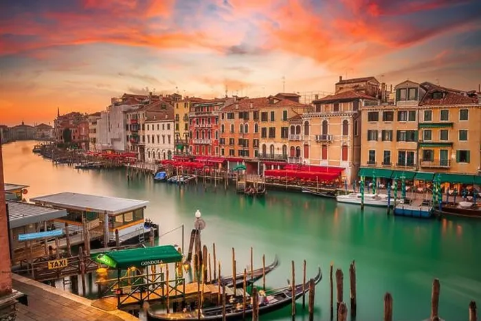 Framed Print : Venice, Italy overlooking boats and gondolas in the Grand Canal at dusk. (Sign reading in Italian No Mafia Venezia e Sacra translates in English to Framed Print : Venice, Italy overlooking boats and gondolas in the Grand Canal at dusk. (Sign reading in Italian No Mafia Venezia e Sacra translates in English to