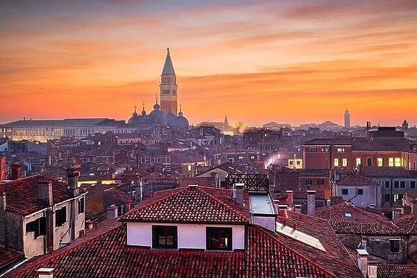 Venice, Italy rooftop skyline and historic landmarks at dusk