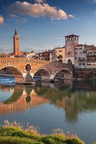 Verona, Italy. Cityscape image of beautiful Italian town Verona with the Stone Bridge over Adige River at sunset
