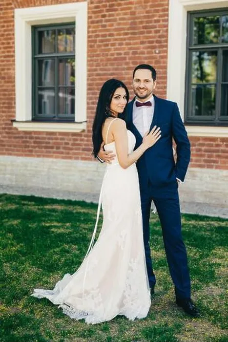 Framed Print : Vertical portrait of attractive bride and handsome bridegroom stand close to each other Framed Print : Vertical portrait of attractive bride and handsome bridegroom stand close to each other