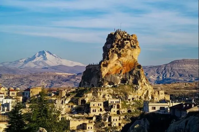 Framed Print : Vew of the Ortahisar Castle in Cappadocia, Turkey with the snow capped Mount Erciyes in the background Framed Print : Vew of the Ortahisar Castle in Cappadocia, Turkey with the snow capped Mount Erciyes in the background