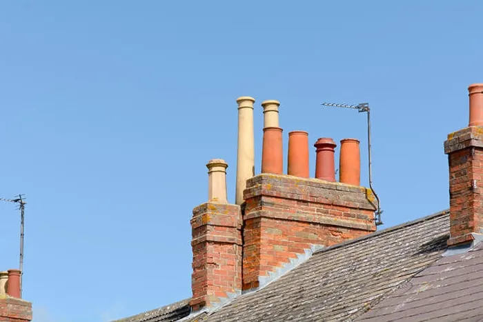 Framed Print : Victorian chimneys and TV aerial on roof of building Framed Print : Victorian chimneys and TV aerial on roof of building