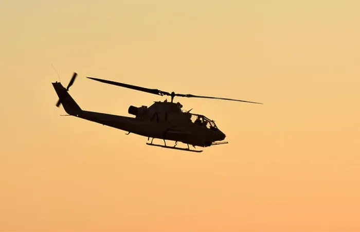 Framed Print : Vietnam War era army helicopter flying at sunset side view Framed Print : Vietnam War era army helicopter flying at sunset side view