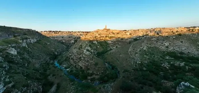Framed Print : View from above, stunning aerial view of the Matera's skyline during a beautiful sunrise with the Gravina river flowing Framed Print : View from above, stunning aerial view of the Matera's skyline during a beautiful sunrise with the Gravina river flowing