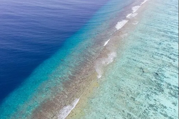 Framed Print : Top view aerial photo from flying drone. Beautiful beach. Aerial view of calm waves, breaking at coral reef. Exotic ocean beach, tropical landscape Framed Print : Top view aerial photo from flying drone. Beautiful beach. Aerial view of calm waves, breaking at coral reef. Exotic ocean beach, tropical landscape
