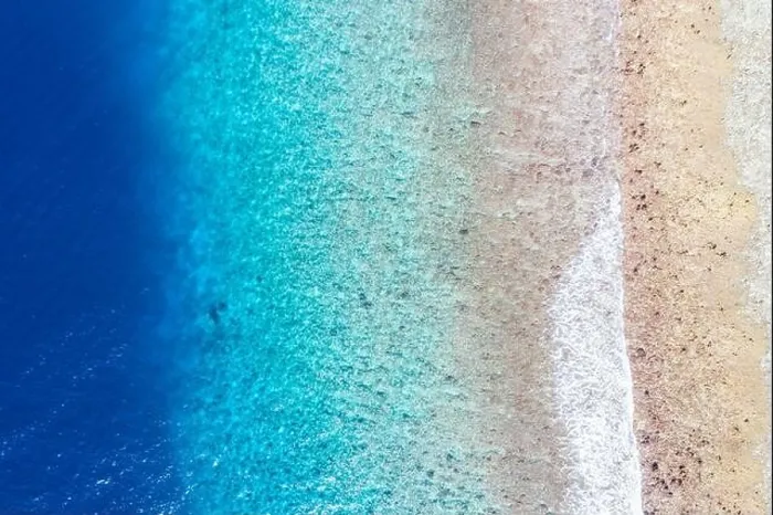Framed Print : Top view aerial photo from flying drone. Beautiful beach. Aerial view of calm waves, breaking at coral reef. Exotic ocean beach, tropical landscape Framed Print : Top view aerial photo from flying drone. Beautiful beach. Aerial view of calm waves, breaking at coral reef. Exotic ocean beach, tropical landscape