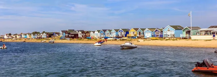 Framed Print : View of the beach huts on Mudeford Sandbank, Christchurch Dorset. England UK taken from the Mudeford Ferry