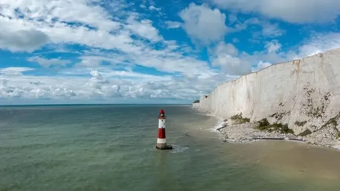Framed Print : view of the Beachy Head Lighthouse in the English Channel with the white cliffs of the Seven Sisters in the background Framed Print : view of the Beachy Head Lighthouse in the English Channel with the white cliffs of the Seven Sisters in the background