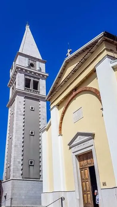 Framed Print : A view on a church and a bell tower from the bottom Framed Print : A view on a church and a bell tower from the bottom