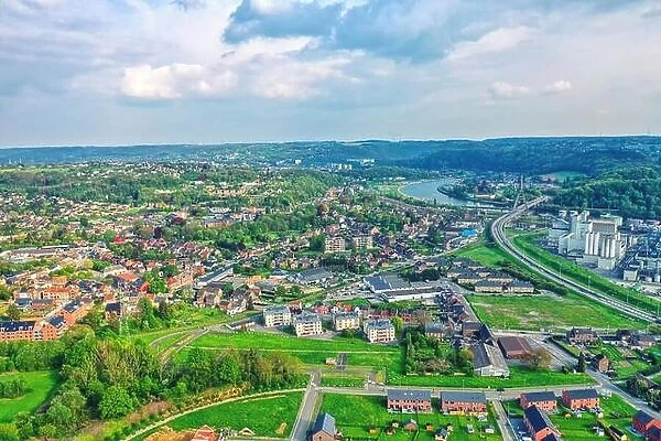 View over the city of Huy in Belgium and Meuse River to the distant nuclear power station of Tihange