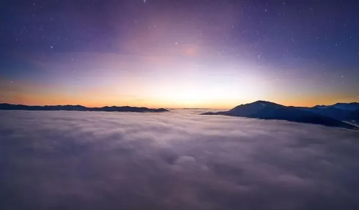 Framed Print : View from the drone at dawn over the clouds with mountains on the grassland Framed Print : View from the drone at dawn over the clouds with mountains on the grassland