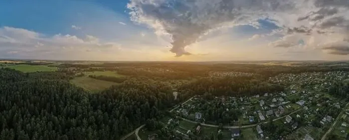 Framed Print : View from drone, panorama orange sky and gray clouds, sun at sunset Framed Print : View from drone, panorama orange sky and gray clouds, sun at sunset
