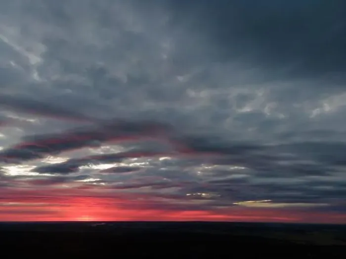 Framed Print : View from drone, panorama orange sky and gray clouds, sun at sunset Framed Print : View from drone, panorama orange sky and gray clouds, sun at sunset