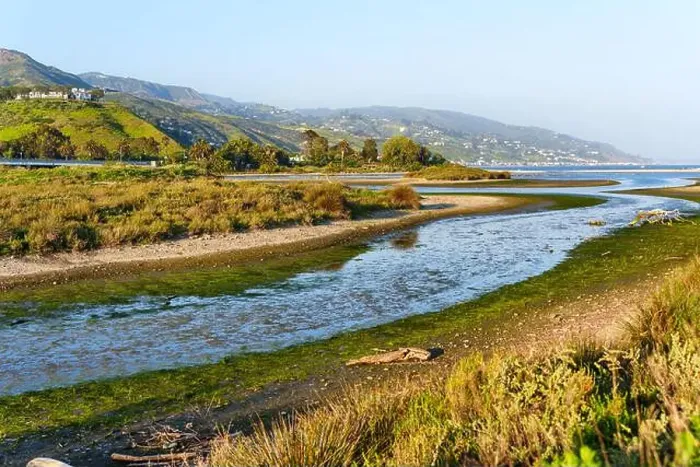 Framed Print : View of flowing waters in Malibu Lagoon surrounded by lush greenery and hills on a sunny day in spring Framed Print : View of flowing waters in Malibu Lagoon surrounded by lush greenery and hills on a sunny day in spring