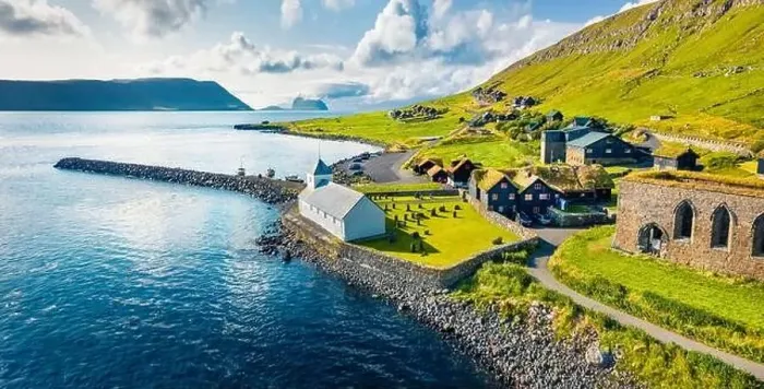 Framed Print : View from flying drone. Aerial summer view of Kirkjubour villagewith Hestur Island on background Framed Print : View from flying drone. Aerial summer view of Kirkjubour villagewith Hestur Island on background