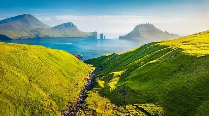 Framed Print : View from flying drone. Colorful summer scene of Faroe Islands and Tindholmur cliffs on background Framed Print : View from flying drone. Colorful summer scene of Faroe Islands and Tindholmur cliffs on background
