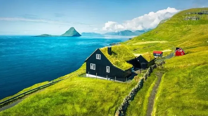 Framed Print : View from flying drone. Dramatic summer view of Velbastadur village with typical turf-top houses Framed Print : View from flying drone. Dramatic summer view of Velbastadur village with typical turf-top houses