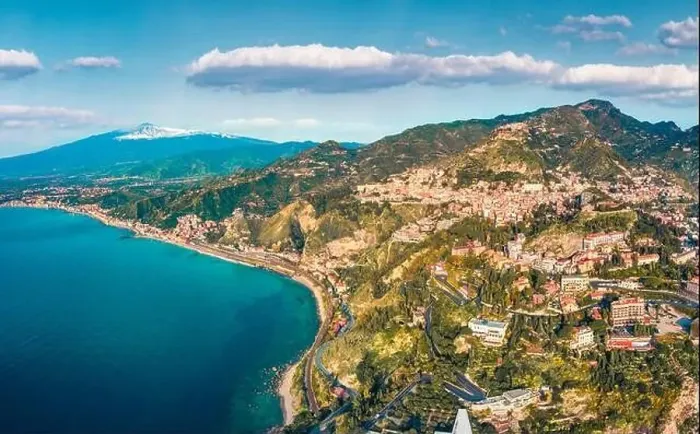 Framed Print : View from flying drone. Marvelous morning view of Taormina town and Etna volcano on background Framed Print : View from flying drone. Marvelous morning view of Taormina town and Etna volcano on background