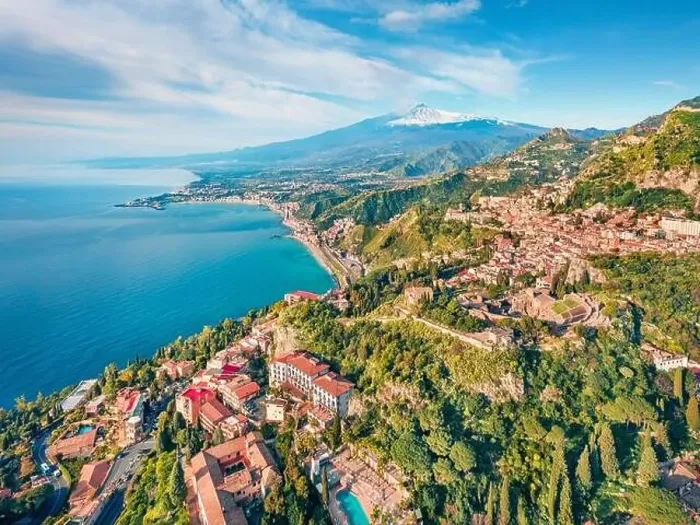 Framed Print : View from flying drone. Sunny morning view of Taormina town and Etna volcano on background Framed Print : View from flying drone. Sunny morning view of Taormina town and Etna volcano on background