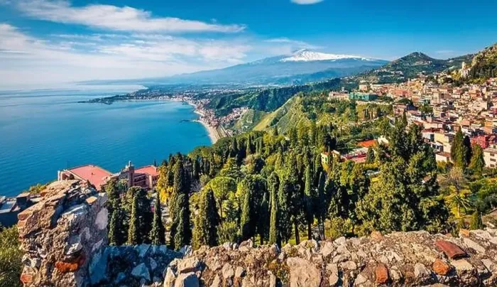 Framed Print : View from flying drone. Sunny morning view of Taormina town and Etna volcano on background Framed Print : View from flying drone. Sunny morning view of Taormina town and Etna volcano on background