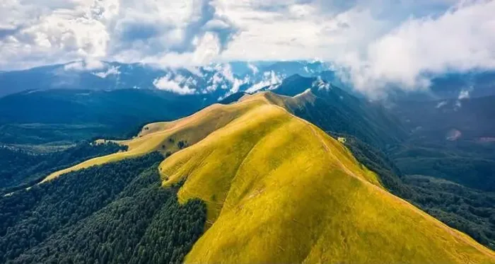 Framed Print : View from flying drone of Svydovets mountain range with old country road in August Framed Print : View from flying drone of Svydovets mountain range with old country road in August