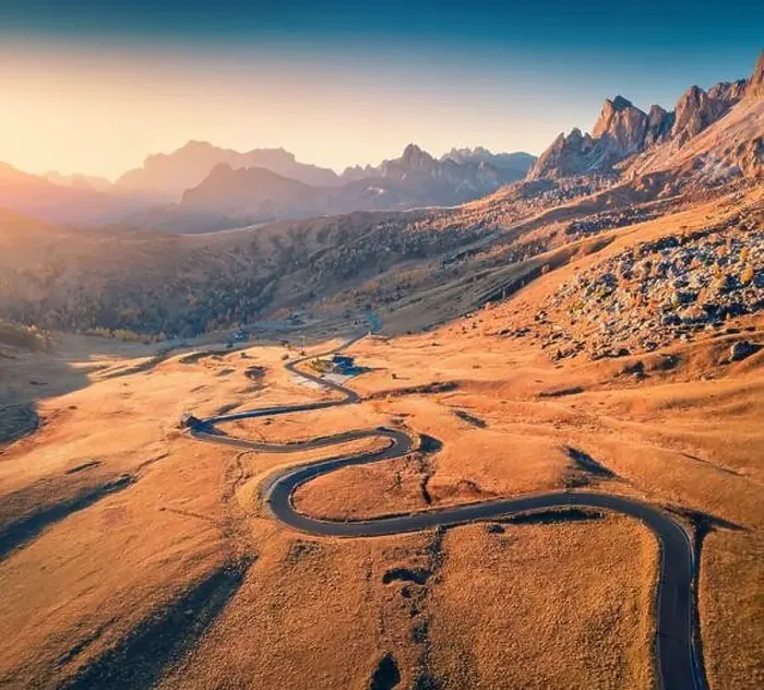 Framed Print : View from flying drone of winding road in Dolomite Alps Framed Print : View from flying drone of winding road in Dolomite Alps
