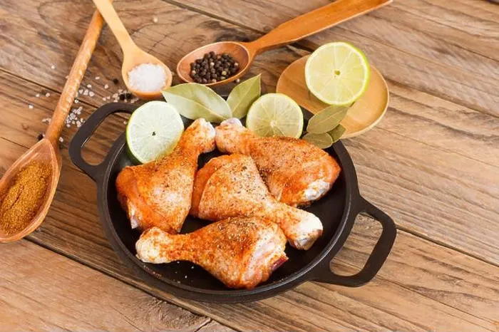 Framed Print : Top view. Food Background. Raw Fresh Chicken legs and marinade ingredients rherbs Framed Print : Top view. Food Background. Raw Fresh Chicken legs and marinade ingredients rherbs