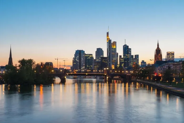 Framed Print : View of Frankfurt am Main skyline at dusk along Main river with cruise ship in Frankfurt, Germany Framed Print : View of Frankfurt am Main skyline at dusk along Main river with cruise ship in Frankfurt, Germany