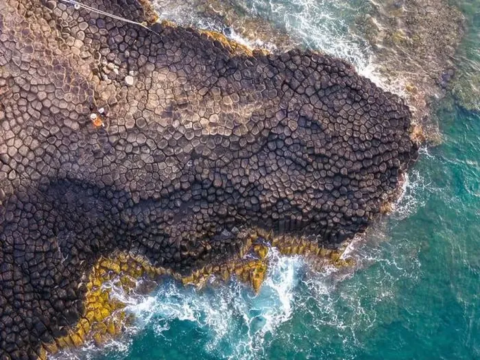 Framed Print : View of Ganh Da Dia or Da Dia Reef is a seashore area of uniformly interlocking basalt rock columns located along Framed Print : View of Ganh Da Dia or Da Dia Reef is a seashore area of uniformly interlocking basalt rock columns located along