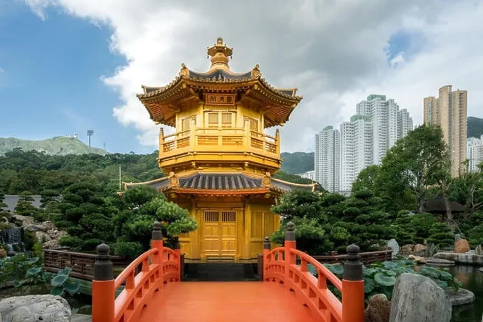 Framed Print : Front view the Golden pavilion temple with red bridge in Nan Lian garden, Hong Kong. Asia Framed Print : Front view the Golden pavilion temple with red bridge in Nan Lian garden, Hong Kong. Asia